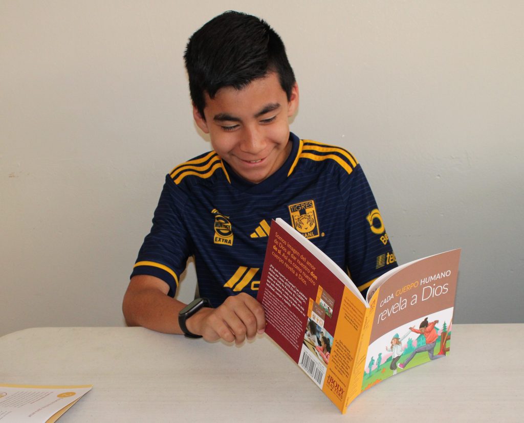Spanish-speaking boy reading TBM