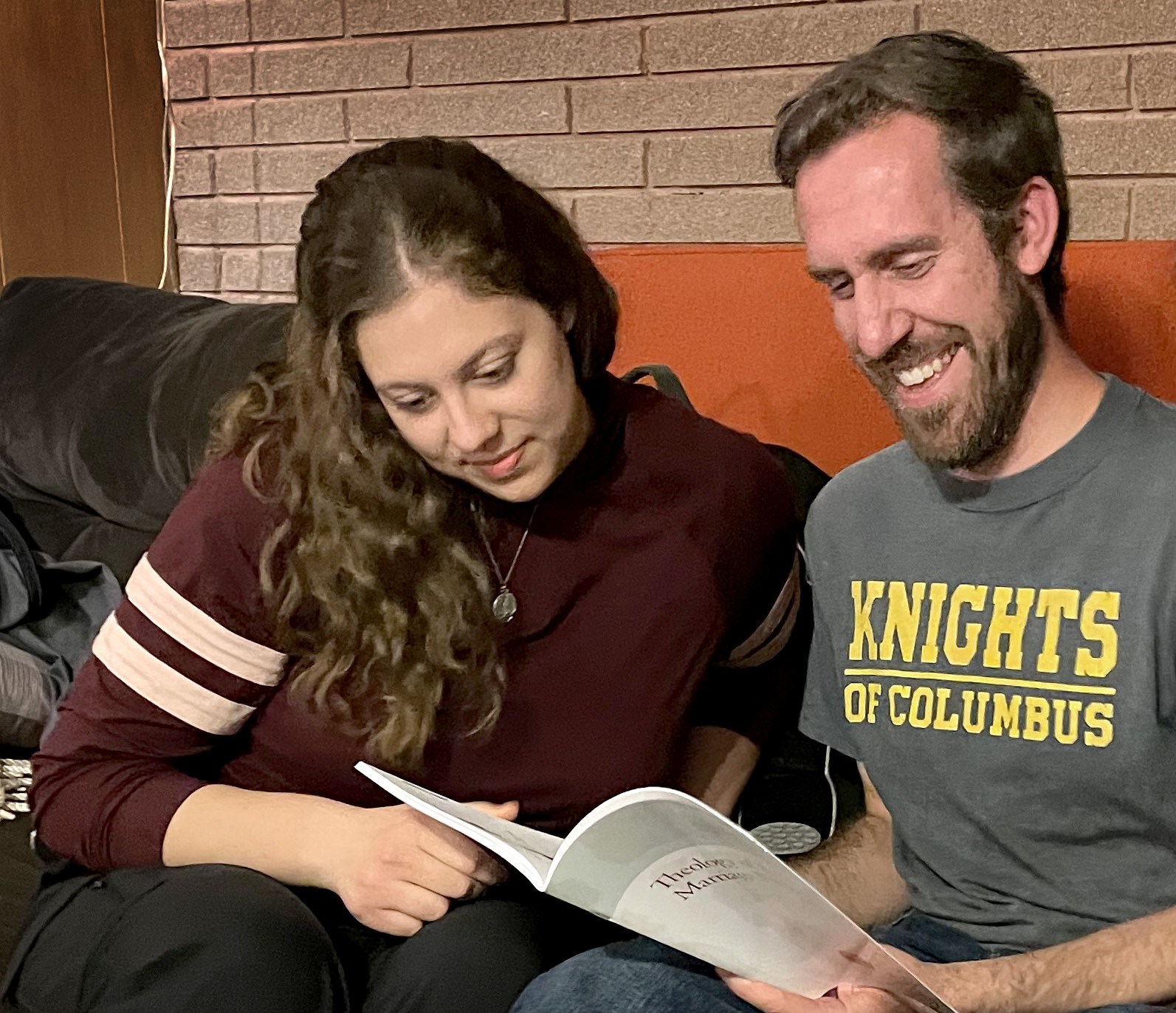 Couple reading T4E book